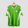 Maillot de foot vintage Algérie Le Coq Sportif, modèle vert avec détails blancs et rouges, logo de la Fédération Algérienne de Football sur la poitrine, édition rétro rare pour supporters et collectionneurs.