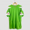 Maillot de foot vintage Algérie Le Coq Sportif, modèle vert avec détails blancs et rouges, logo de la Fédération Algérienne vue de dos