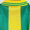 Maillot Adidas des Canaris, porté en 1995-1996, design rayé vert et jaune, col polo, sponsor Eurest au centre, logo du club sur la poitrine.