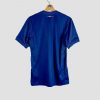 Vue de dos du maillot domicile 2024-2025 du Paris Saint-Germain, de couleur bleu marine unie, sans numéro ni flocage