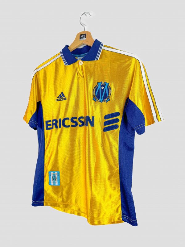 Maillot rétro Olympique de Marseille 1998-1999, design unique jaune et bleu, col polo Adidas.