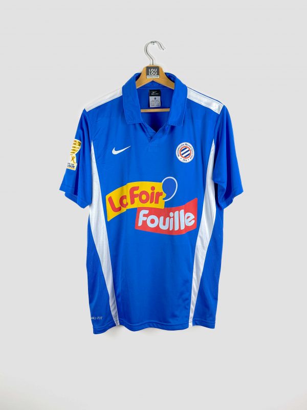Maillot du Montpellier HSC saison 2010-2011 bleu ciel floqué du sponsor “La Foir’Fouille”