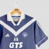 Maillot rétro Bordeaux 1999-2000 porté en Ligue des Champions, style classique Adidas à chevrons blancs.