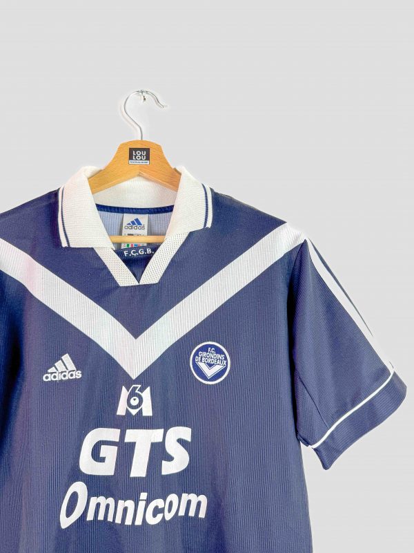 Maillot rétro Bordeaux 1999-2000 porté en Ligue des Champions, style classique Adidas à chevrons blancs.