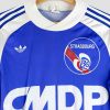 Détail du logo rétro et du sponsor d’époque sur le maillot vintage du RC Strasbourg 1978/1979